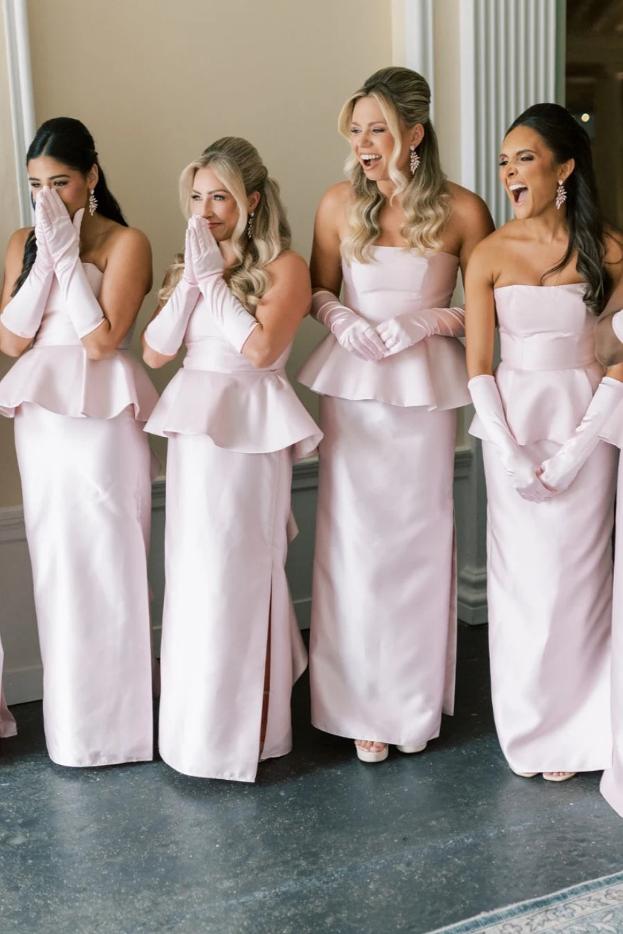 Blush pink strapless peplum satin bridesmaid dress with side slit