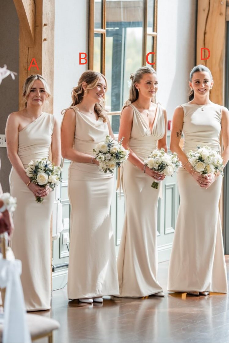 Four bridesmaids wearing matching off-white/cream one-shoulder and V-neck floor-length dresses, standing indoors and holding white rose bouquets. Red letters A, B, C, and D are overlaid above each woman.