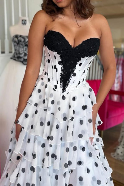 Strapless black polka dot tiered chiffon prom gown with high slit
