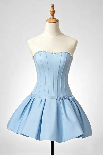 A light blue strapless corset-style homecoming dress displayed on a cream mannequin torso against a light gray studio background.