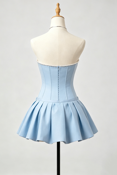 A light blue strapless corset-style homecoming dress displayed on a cream mannequin torso against a light gray studio background.