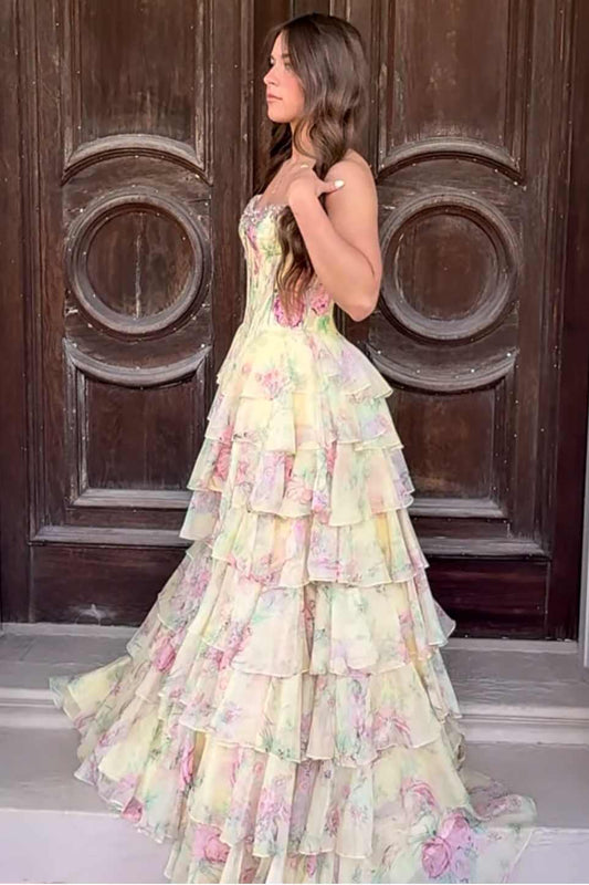 Side view of floral empire waist prom dress showing tiered ruffle