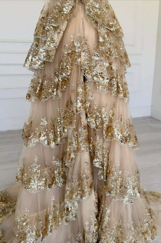 Close-up of sequin embellishments on gold off shoulder bodice