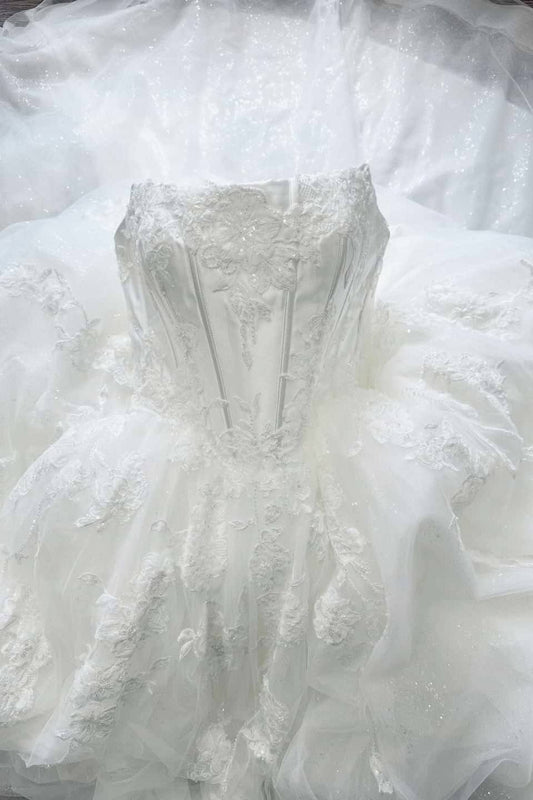 Close-up of delicate applique detailing on ivory tulle bodice