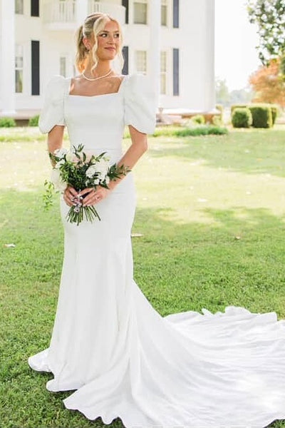 Ivory puff sleeve fit and flare wedding dress with train