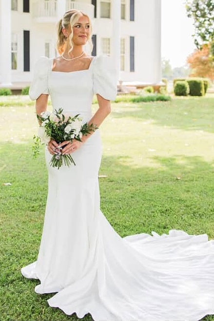 Ivory puff sleeve fit and flare wedding dress with train