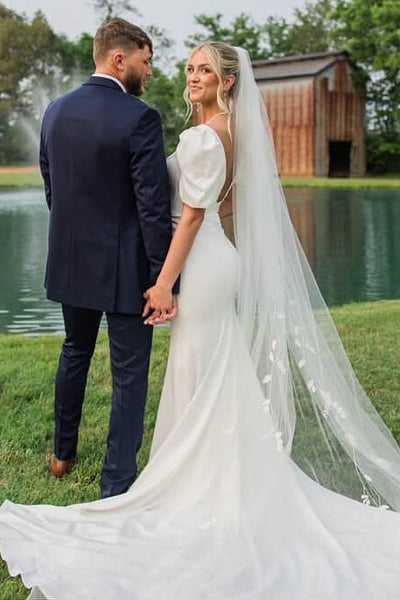 Ivory puff sleeve fit and flare wedding dress with train