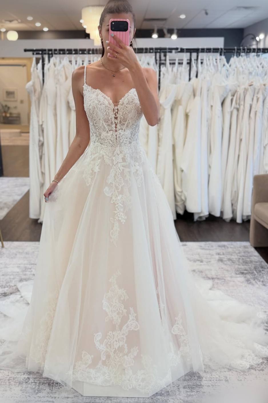 Woman wearing a white lace wedding dress.