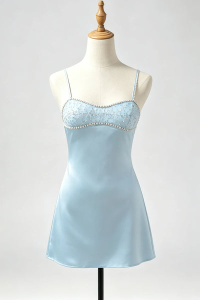 A light blue satin slip dress with thin straps and a lace-trimmed bust adorned with small pearls, displayed on a cream mannequin against a light gray background.