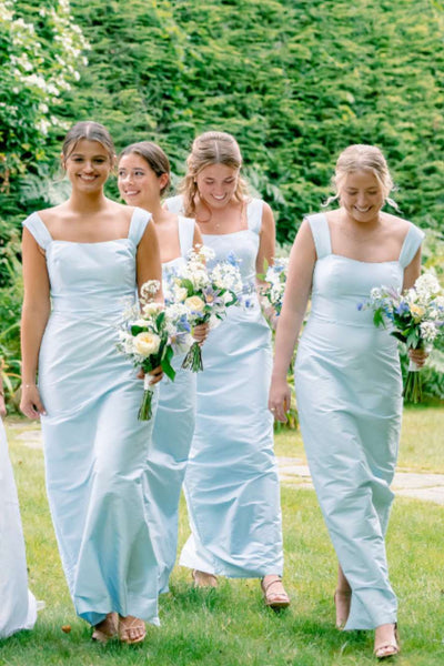 Side view of light blue sheath dress showing square neckline and wide straps