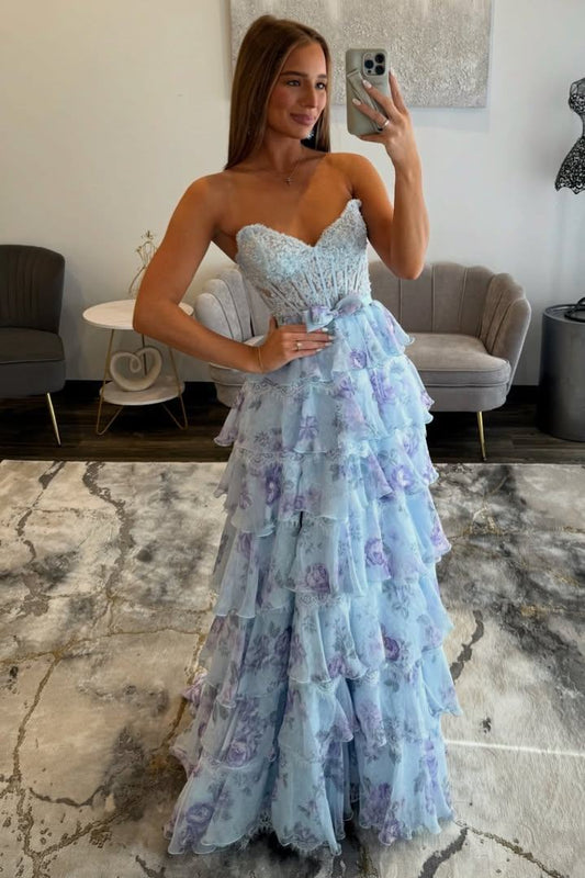 Light blue sweetheart tiered prom dress with waist bow