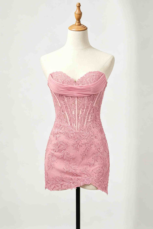 A pink strapless lace homecoming dress displayed on a cream mannequin torso with a wooden neck cap against a light gray studio background.