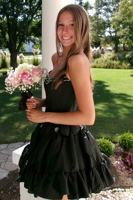 Side view of rhinestone black strapless trim strapless corset homecoming dress