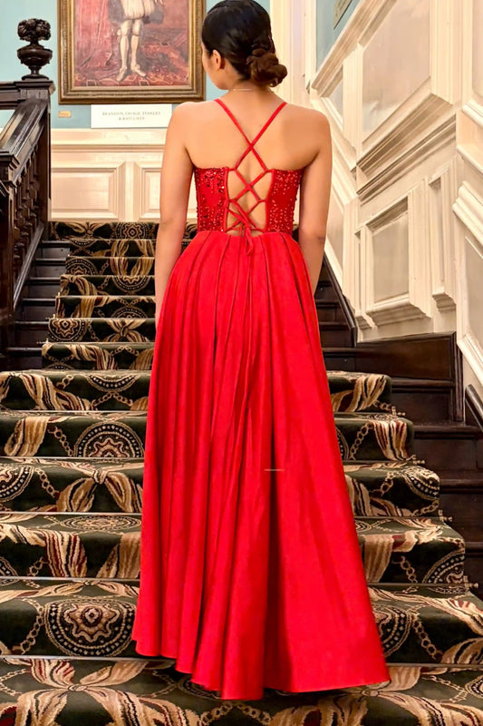 Back view of red sequin prom dress with lace-up back detailing