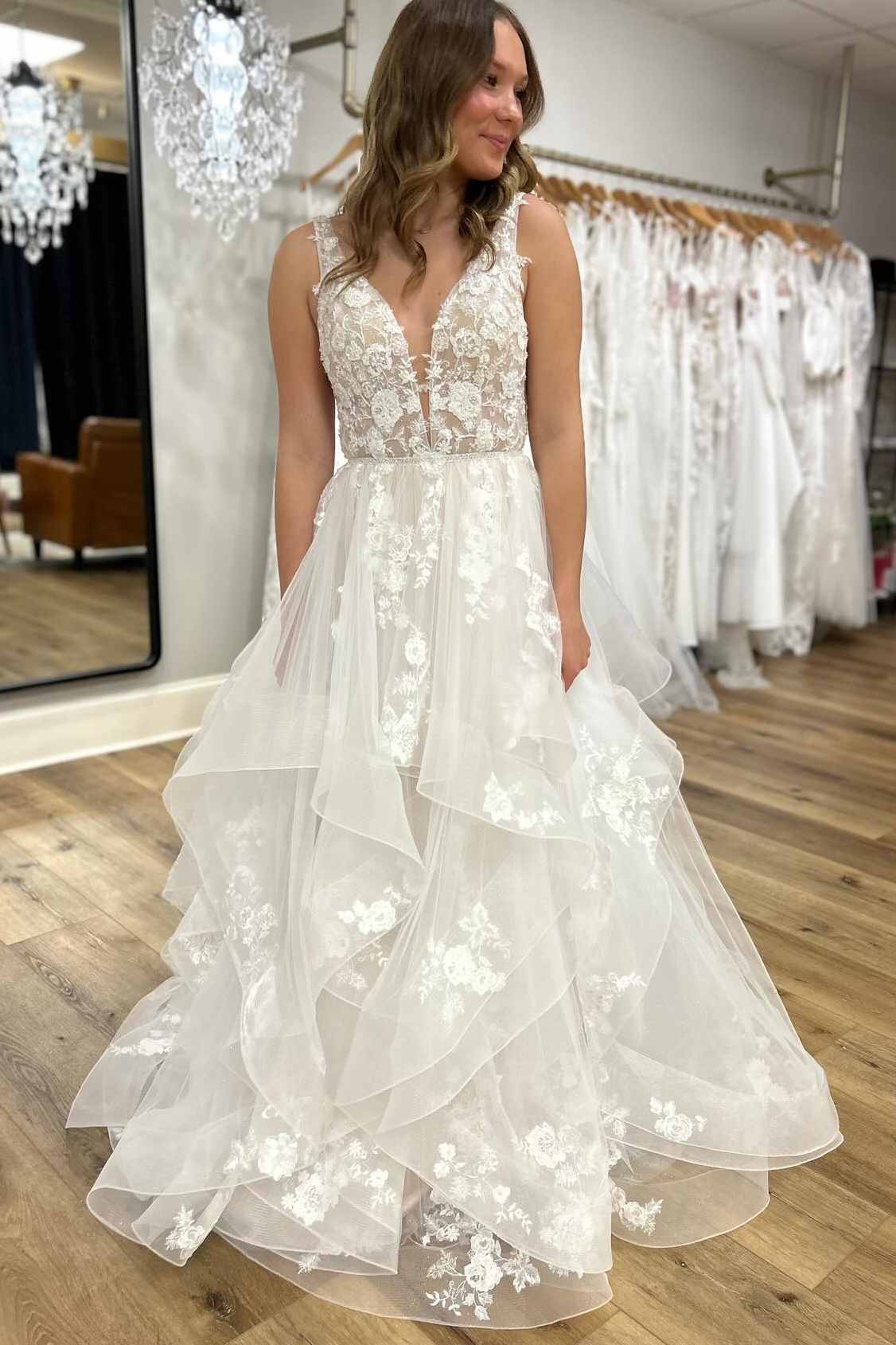 Sleeveless V neck lace applique tiered A-line wedding gown
