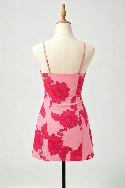 A pink homecoming dress with a bold dark pink floral pattern.
