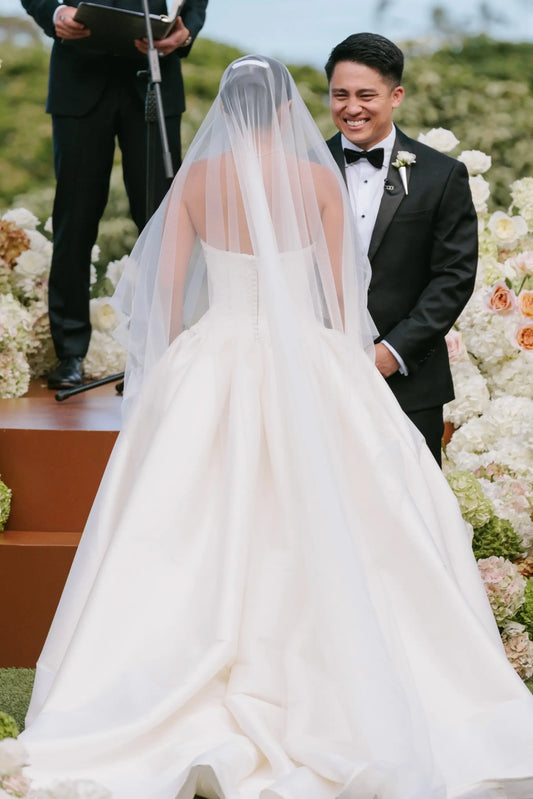 Back view of white lace applique strapless A-line wedding dress