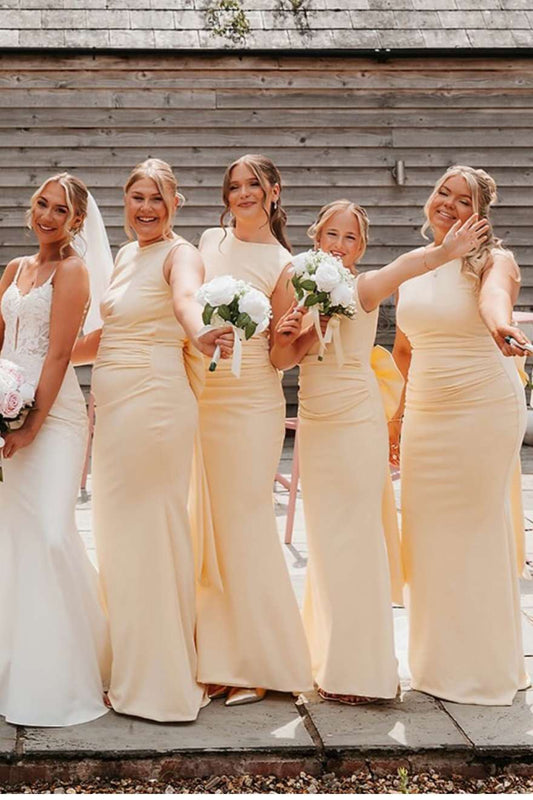 Yellow sleeveless open back bridesmaid dress with back bow