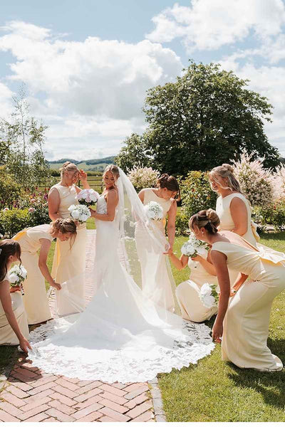 Yellow sleeveless open back bridesmaid dress with back bow