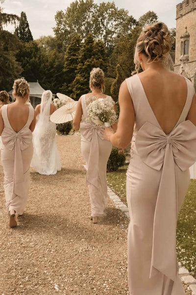 Yellow sleeveless open back bridesmaid dress with back bow