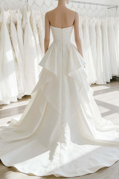 Ethereal ruffle white satin wedding gown with sweetheart neckline and cascading ruffles on the skirt, front view